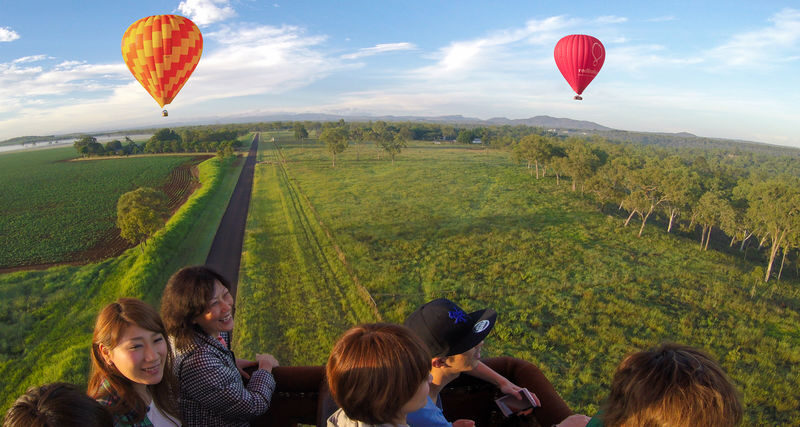 Hot Air Balloon Experience in Cairns and Port Douglas - Landing, a toast and the balloon packdown