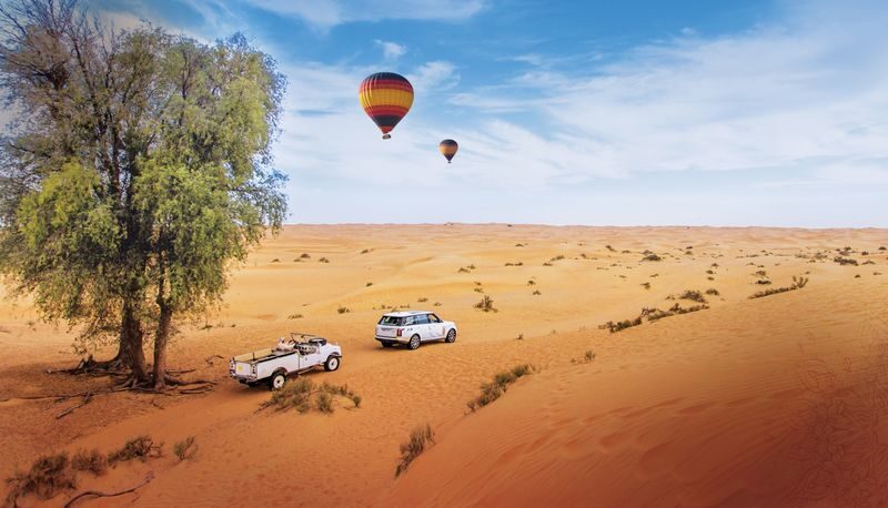 Hot Air Balloon Flight Experience in Dubai - Watching the balloon rise over the dunes