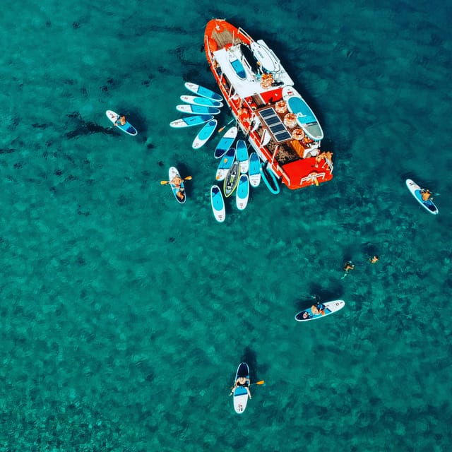 Ibiza: Secret Coves Guided Boat Tour With Open Bar and Tapas - Onboard Culinary Delights