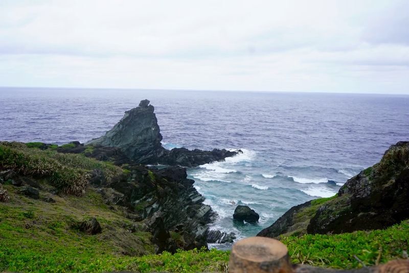 Ishigaki Island Guided Sightseeing Photo Tour: Visiting Popular Spots like Kabira Bay with Photo Data Included - Oganzaki Lighthouse brings the coast into view