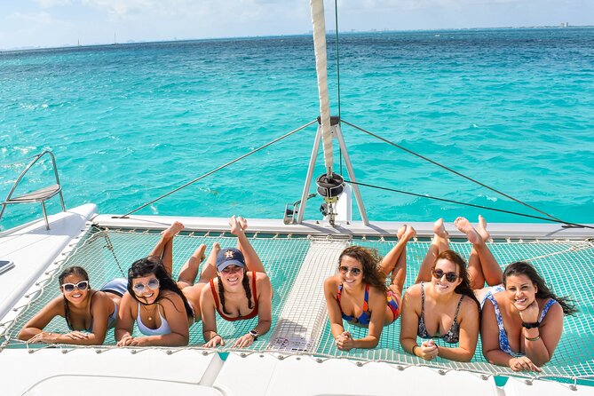 Isla Mujeres Catamaran Tour With Snorkel, Open Bar and Transportation From Hotel - Open Bar and Entertainment