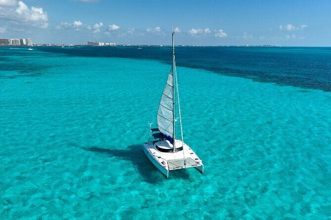 Isla Mujeres Catamaran Tour with Snorkeling, Open Bar & Buffet - The Sum Up