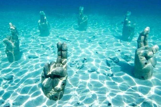 Isla Mujeres on luxury catamaran with snorkel, open bar and lunch - Authentic Insights from Reviews