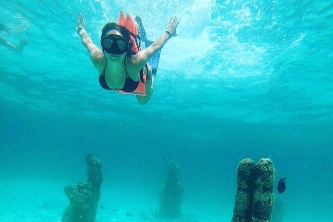 Isla Mujeres party on board! Catamaran,Lagoon,Snorkel & Downtown - The Sum Up