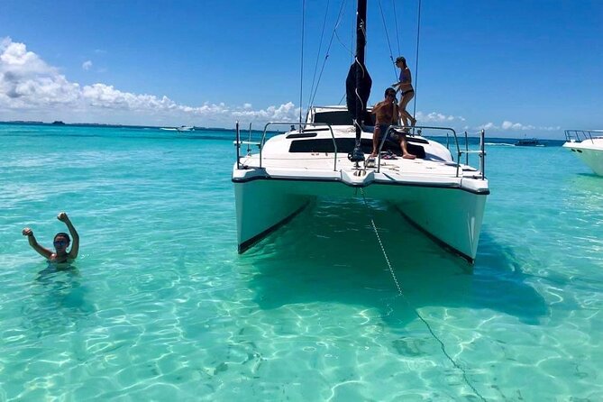 Isla Mujeres Private Catamaran Cruising N Snorkeling Full Day 6hr - Highlights of Isla Mujeres: Beautiful Beaches and Scenic Views