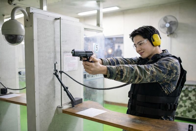Jeju Real Gun Shooting Range Experience - Protect your arms from hot casings