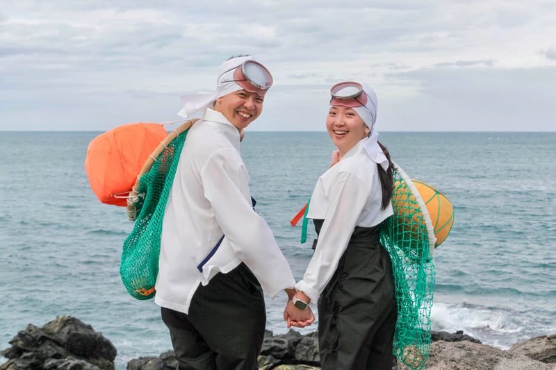 Jeju Traditional Sea Woman Haenyeo Cultural Experience - Taking the costume outdoors near Yongduam