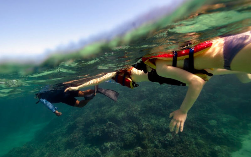 Kaneohe Bay Sandbar Adventure Half-Day Tour - The banana boat calls for a ready grip