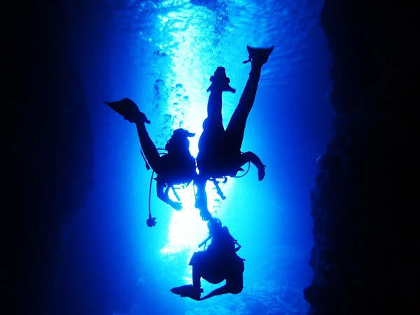 Korean Support: Okinawa Blue Cave Boat Experience Diving (Free Photo Shoot/No License Required) - The Blue Cave from the water