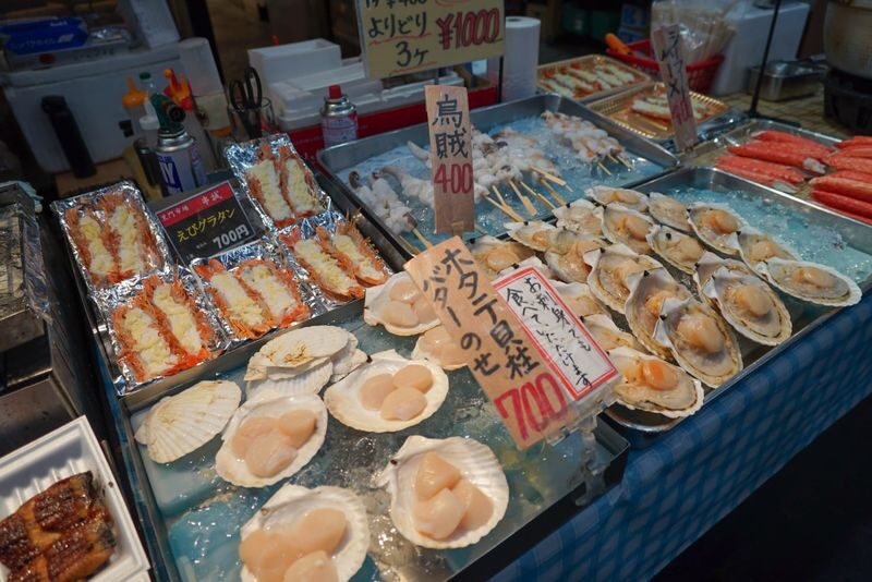 Kuromon Market Half Day Food Walking Tour in Osaka - Tasting your way through the market
