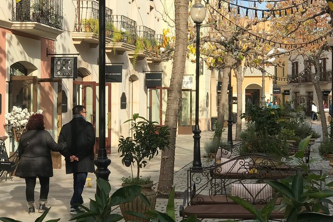 La Roca Village: Private Round-Trip Transfer - Pricing and Booking Details