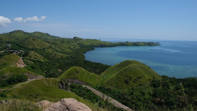 Labuan Bajo Half-Day Batu Cermin & Bukit Sylvia Tour - A cave and a hill, with two different kinds of scenery