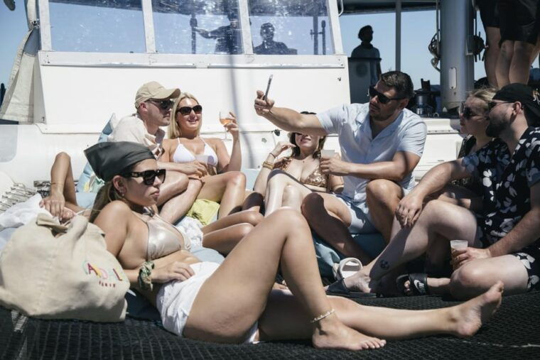 Lisbon: Catamaran Boat Party with Music, Open Bar & Dives - What’s Not Included