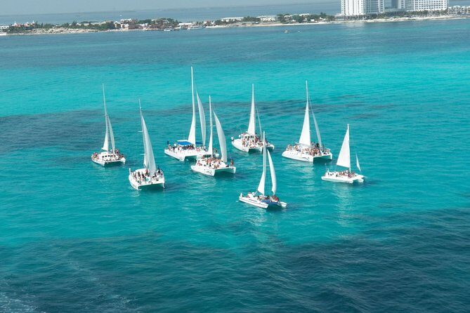 Live this unique experience. Catamaran to Isla Mujeres Tour. Open Bar included. - Who Should Consider This Tour?