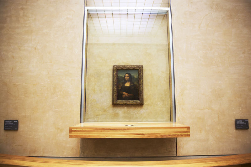 Louvre Museum Tour with Mona Lisa Visit - The Mona Lisa: a small painting with a large crowd