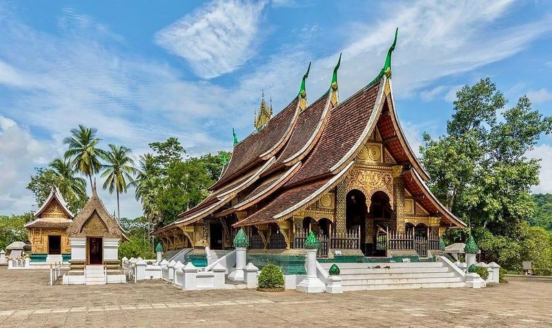 LuangPrabang Morning Alms Giving City Tour& Kuang Si Falls - What the price covers, and what it does not