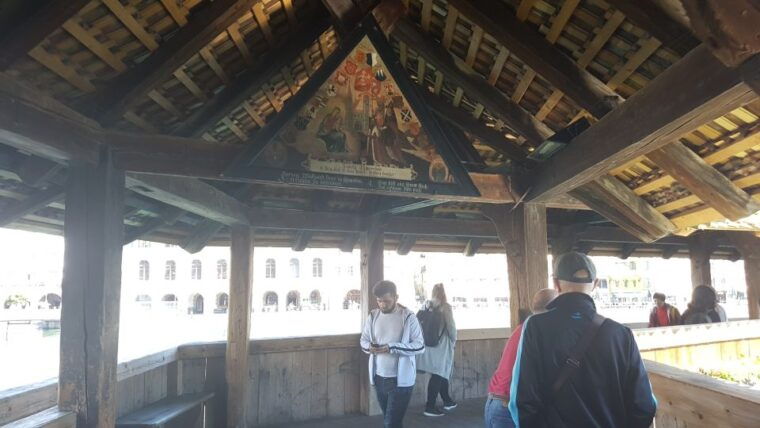 Luzern Elegance: Private City Walk and Panoramic Lake Cruise - Crossing the Chapel Bridge