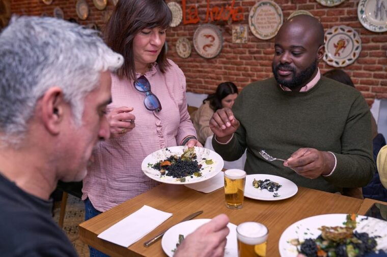 Madrid: Not Just Another Tapas & Wine Tour - Slicing Jamón Ibérico and Tasting Fried Calamari Sandwiches