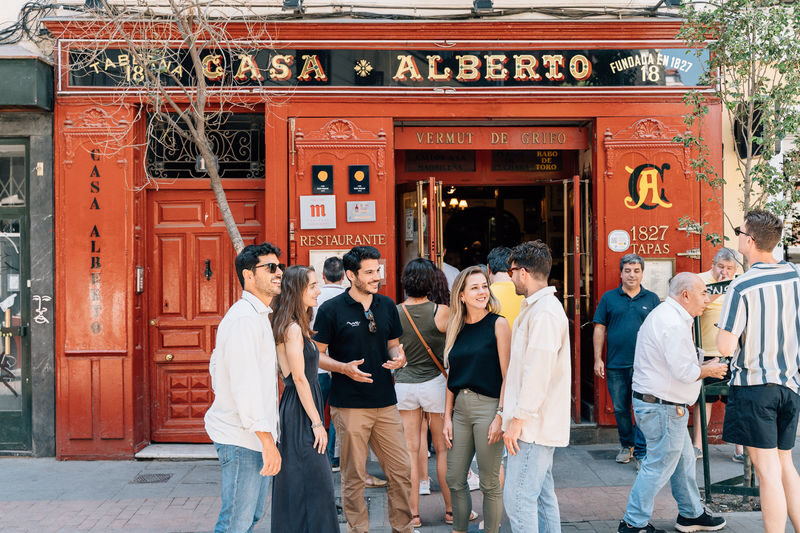 Madrid Tapas and Wine Tour with Optional Rooftop Drinks - Meat cheeks, wine and garlic shrimp