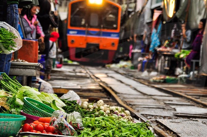 Maeklong Train Market and Damnern Saduak Floating Market Tour With English Guide - English Guide Information