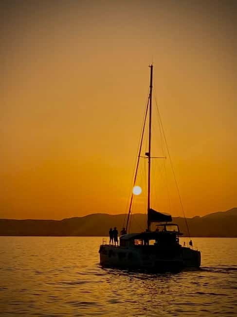 Majorca: Dinner aboard a private catamaran with snorkeling and paddle surfing - An Authentic Mallorca Experience: What to Expect