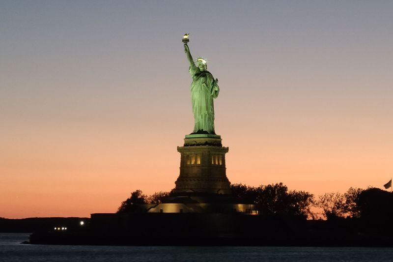 Manhattan Skyline and Statue of Liberty Night Cruise in New York - Decks, music, drinks, and snacks