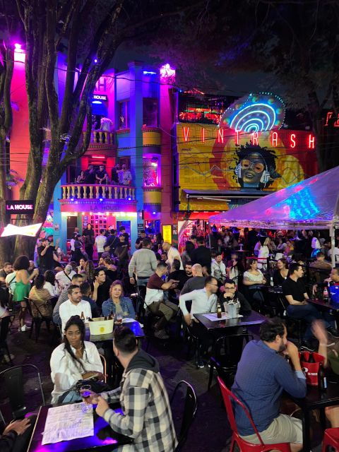Medellin: Pub Crawl Nightlife With Aguardiente Tasting - Engaging in Medellins Nightlife