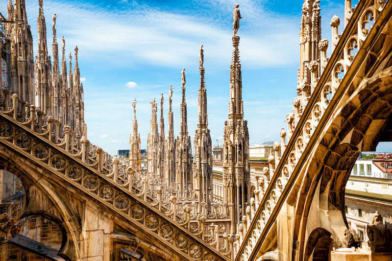 Milan Duomo Guided Tour with Rooftop Terrace Access - Ride up, then walk among the spires