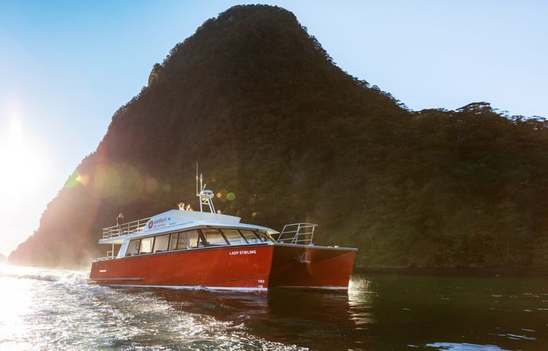 Milford Sound Scenic Flight & Cruise from Queenstown - Landing beneath Mitre Peak and walking to the boat