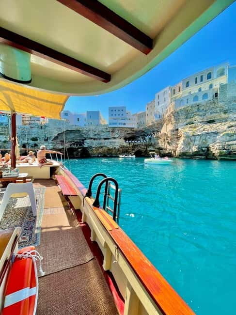 Monopoli-Polignano: sunset boat tour on a traditional wooden boat - Good To Know