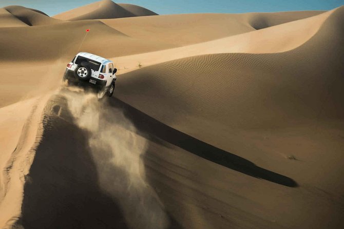 Morning Dubai Desert Safari With Dune Bashing & Sandboarding & Camel Riding - Try Sandboarding Down the Golden Sands