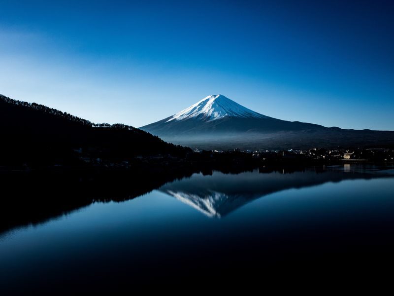 Mt. Fuji Day Tour: Flower Sightseeing & Outlet Shopping from Tokyo - Gotemba adds shopping, with a clock attached