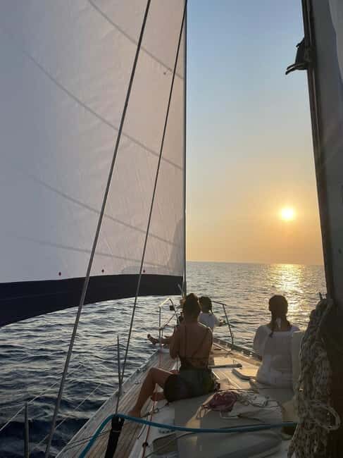 Mykonos: Sunset Sail Cruise to Rhenia, Beach Hopping, Dinner - Greek Buffet and Drinks