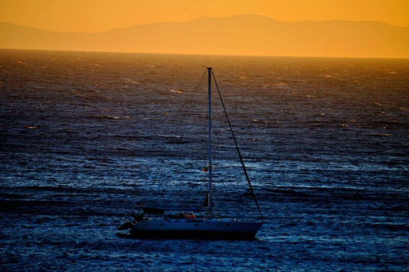 Mykonos: Sunset Sail Cruise to Rhenia, Beach Hopping, Dinner - Sunset Magic and Scenic Return