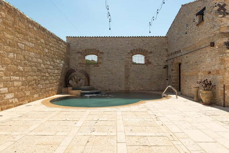 Nature and relaxation by the pool at Baglio Passofondo Estates - Frequently Asked Questions