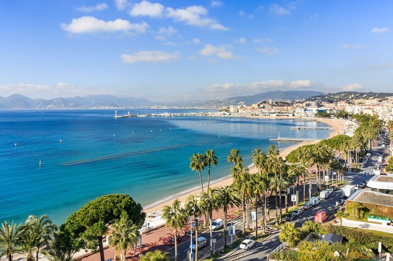 Nice Half-Day Cannes & Antibes Old Town Tour - A small vehicle, with a guide at the centre