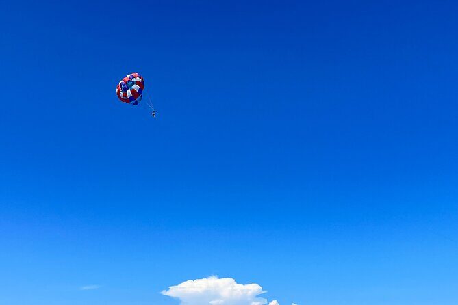 Parasailing above Turquoise Ocean Waters in Montego Bay - The Sum Up