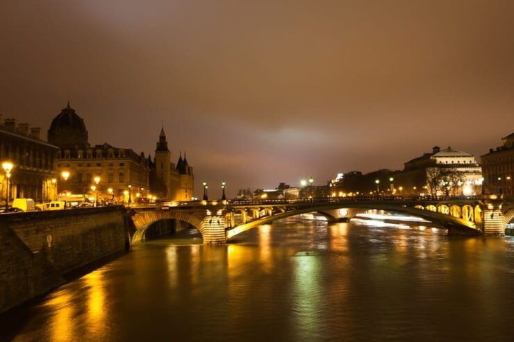 Paris Illuminated Walking Tour in Spanish - Key Points