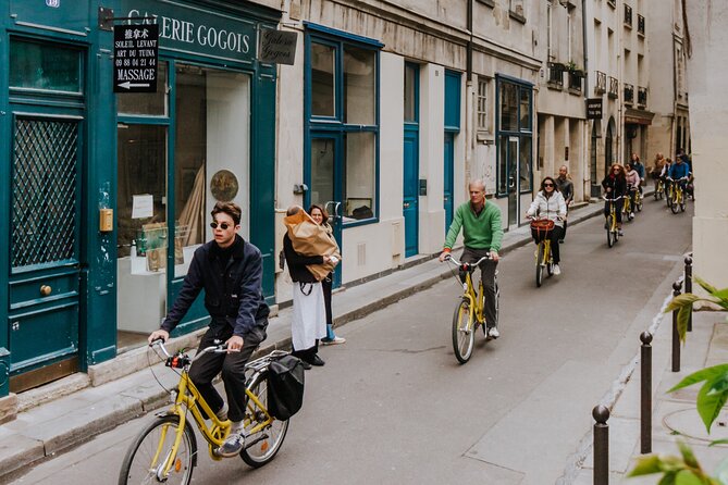 Paris Local Districts and Stories Off the Beaten Track Guided Bike Tour - Tour Overview and Features