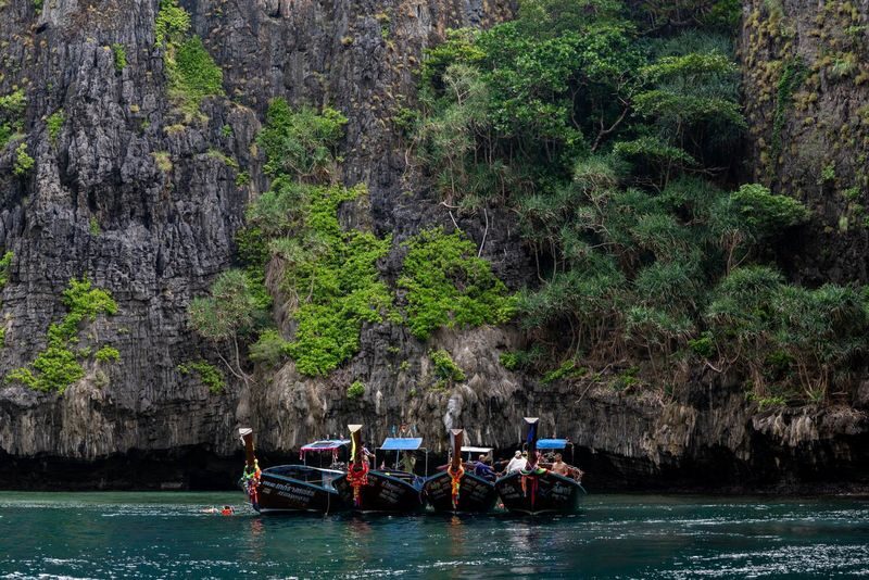 Phi Phi Sunrise Small Group Speedboat Tour by Simba Sea Trips - Swimming in Pileh Lagoon