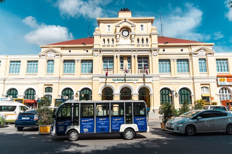 Phnom Penh Heritage Half-Day Small Group Tour - Central Market and a hotel with a past
