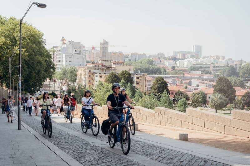 Porto Highlights Electric Bike Tour - Seeing Porto’s churches, tower and bookshop
