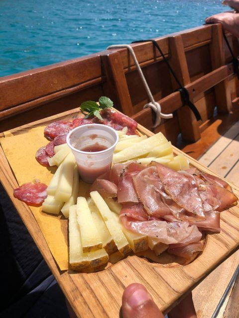 Porto San Paolo: Vintage Cruise Sunset Aperitif to Tavolara - Inclusions Provided