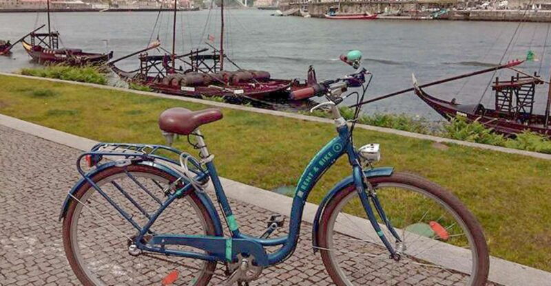 Porto: Self-Guided Bike and Boat Tour with Port Wine Tasting - Cruising Under Bridges on a Rabelo Boat