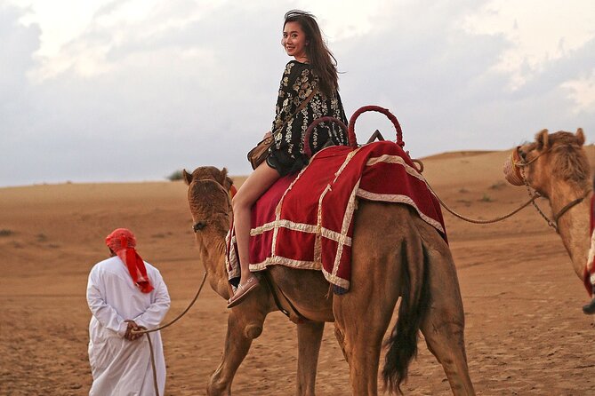 Private Red Sand Desert Safari With Camel Ride and Sand Boarding - Sandboarding During Sunrise or Sunset