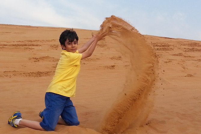Red Dune Desert Safari & Quad Bike, BBQ Dinner. Camel Ride, Sandboarding - Upgrade Options and Entertainment