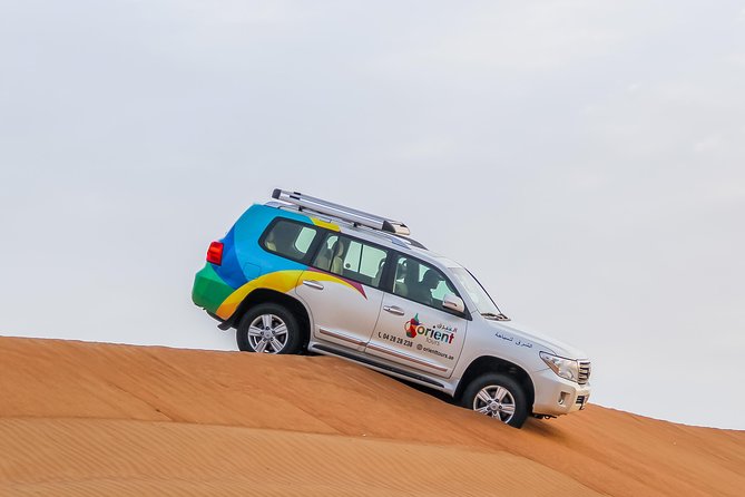Red Dune Desert Safari,Camp Activities, BBQ Dinner, Live Show & Quad Bike Drive - Camel Farm and Sunset Experience