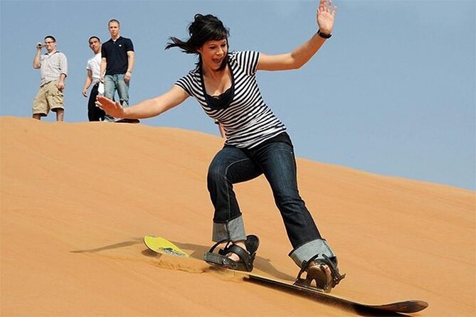 Red Dunes Desert Safari Dubai With Camel Riding and BBQ Dinner - Unwind With Traditional Entertainment and Music