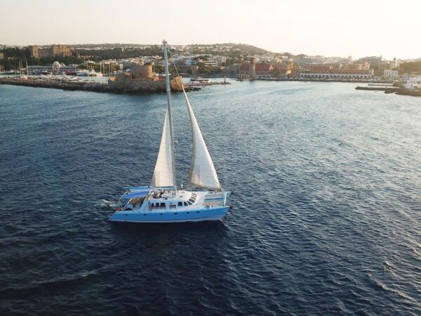 Rhodes: Catamaran Cruise With Snacks, Wine & Sunset Viewing - The Sum Up