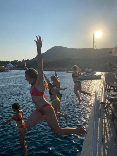 Rhodes: Sunset Cruise with Open Bar, Dinner, & Live Music - The Kalithea Bay Stop – A Perfect Swim and Photo Opportunity